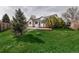 Lush backyard with a stone patio and landscaped area at 2132 Boise Ct, Longmont, CO 80504
