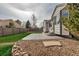 Backyard featuring a patio and rock landscaping at 2132 Boise Ct, Longmont, CO 80504