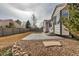 Lush backyard with a patterned patio, rock garden, and privacy fence for outdoor enjoyment at 2132 Boise Ct, Longmont, CO 80504
