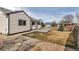 Well-maintained backyard featuring a patio, lush lawn, rock garden and a charming fence at 2132 Boise Ct, Longmont, CO 80504