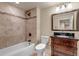 Bathroom featuring vanity with dark wood cabinets, granite countertop, and shower at 2132 Boise Ct, Longmont, CO 80504