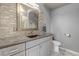 Bathroom features gray walls, designer tile accents, and a modern vanity at 2132 Boise Ct, Longmont, CO 80504