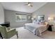 Comfortable bedroom with carpet, ceiling fan and nice light from a window at 2132 Boise Ct, Longmont, CO 80504