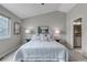 Cozy bedroom features plush carpeting, a gray color scheme, and an ensuite bathroom at 2132 Boise Ct, Longmont, CO 80504