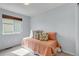 Cozy bedroom with a window providing natural light and soft colored walls at 2132 Boise Ct, Longmont, CO 80504