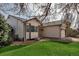 Charming home exterior with well-maintained lawn, stone landscaping, and attached garage at 2132 Boise Ct, Longmont, CO 80504