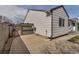 Home exterior showcasing siding, and a concrete patio leading to a fenced area at 2132 Boise Ct, Longmont, CO 80504