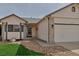 Charming home exterior with a covered entry, attached garage, and low-maintenance landscaping at 2132 Boise Ct, Longmont, CO 80504