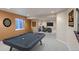 Finished basement with pool table and adjacent living area at 2132 Boise Ct, Longmont, CO 80504