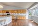Spacious eat-in kitchen features wood floors, granite countertops, stainless steel appliances and lots of cabinets at 2132 Boise Ct, Longmont, CO 80504