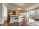 Open kitchen featuring a central island with seating and lots of cabinet space at 2132 Boise Ct, Longmont, CO 80504