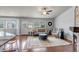 Comfortable living room features hardwood floors, a cozy fireplace, and abundant natural light at 2132 Boise Ct, Longmont, CO 80504