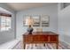 Bright office space with a large window, classic wooden desk, and neutral decor at 2132 Boise Ct, Longmont, CO 80504