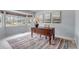 Bright office space with a large window, classic wooden desk, and neutral decor at 2132 Boise Ct, Longmont, CO 80504