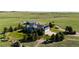 Aerial view of the home, barn, and surrounding land at 10515 Lucas Ave, Franktown, CO 80116