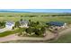 Expansive aerial view of the house, barn, and landscaped grounds at 10515 Lucas Ave, Franktown, CO 80116