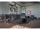 A home wet bar with granite countertops, custom gray cabinetry, and bar refrigerator at 10515 Lucas Ave, Franktown, CO 80116