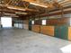 Interior view of the horse barn showcasing the stalls at 10515 Lucas Ave, Franktown, CO 80116