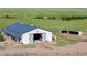 Well-maintained barn with ample space and a functional design, perfect for livestock or storage at 10515 Lucas Ave, Franktown, CO 80116