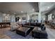 Spacious basement featuring a sectional sofa, wet bar, and recreational area at 10515 Lucas Ave, Franktown, CO 80116