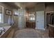 Serene bathroom featuring modern fixtures, tile flooring, separate shower and soaking tub at 10515 Lucas Ave, Franktown, CO 80116
