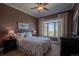 Comfortable bedroom with a serene ambiance, a large window providing natural light, and classic decor at 10515 Lucas Ave, Franktown, CO 80116