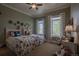Bright bedroom with matching twin beds, decorative accents, and lots of natural light at 10515 Lucas Ave, Franktown, CO 80116