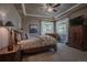 Bedroom featuring a floral comforter, two windows providing excellent natural light at 10515 Lucas Ave, Franktown, CO 80116