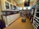 Walk-in closet featuring custom shelving, drawers, and ample storage space for organization at 10515 Lucas Ave, Franktown, CO 80116