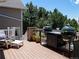 Outdoor deck area with outdoor furniture and two grills, perfect for entertaining at 10515 Lucas Ave, Franktown, CO 80116