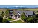 Stunning home with lush landscaping and a grand entrance, set against a beautiful mountain backdrop at 10515 Lucas Ave, Franktown, CO 80116