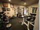 Home gym equipped with weightlifting machines, free weights, and rubber flooring for fitness enthusiasts at 10515 Lucas Ave, Franktown, CO 80116