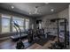 Exercise/gym room with modern equipment, natural light and wood laminate flooring at 10515 Lucas Ave, Franktown, CO 80116