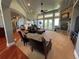 Bright living room with fireplace, large windows, and access to the outdoor patio at 10515 Lucas Ave, Franktown, CO 80116