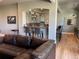 Open floor plan with wet bar area, granite countertop, and modern decor at 10515 Lucas Ave, Franktown, CO 80116