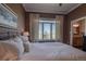 This is a cozy main bedroom with great natural lighting and a view of the neighborhood at 10515 Lucas Ave, Franktown, CO 80116