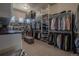 Large walk-in closet with custom shelving and ample space for clothing and accessories at 10515 Lucas Ave, Franktown, CO 80116