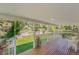 Covered back porch overlooking a green lawn and mature landscaping at 9948 King St, Westminster, CO 80031