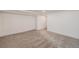Spacious carpeted basement providing ample room for storage or customized living space at 9948 King St, Westminster, CO 80031