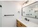 Bright bathroom featuring a modern vanity, stylish fixtures, and a glass-enclosed tiled shower at 9948 King St, Westminster, CO 80031