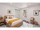Bright bedroom boasts natural light, plush carpet, and a modern design at 9948 King St, Westminster, CO 80031