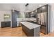 Stylish kitchen boasts stainless appliances, quartz counters, and lots of cabinet space at 9948 King St, Westminster, CO 80031