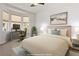 Bedroom featuring a workstation near a bay window, a bed, and neutral tones providing a calm and functional space at 13739 Legend Trl # 102, Broomfield, CO 80023