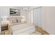 Inviting bedroom featuring carpet, soft neutral tones, a large bed, and closet storage space, creating a serene atmosphere at 13739 Legend Trl # 102, Broomfield, CO 80023