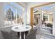 Bright breakfast nook with a round table, chairs, and large windows offering natural light and views at 13739 Legend Trl # 102, Broomfield, CO 80023