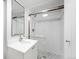 Modern bathroom with a glass-enclosed shower and patterned tile floor, next to sink at 2020 E 4Th Ave, Denver, CO 80206