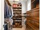 Custom closet featuring extensive shelving, hanging space, and storage drawers at 2020 E 4Th Ave, Denver, CO 80206