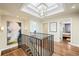 Upstairs hallway with hardwood floors, decorative painting, and natural light at 2020 E 4Th Ave, Denver, CO 80206