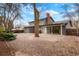 Expansive backyard features a covered patio, mature trees, and manicured landscaping at 4682 Chatham St, Boulder, CO 80301