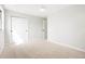 Carpeted bedroom with closet and white walls offering a clean and simple aesthetic at 4682 Chatham St, Boulder, CO 80301